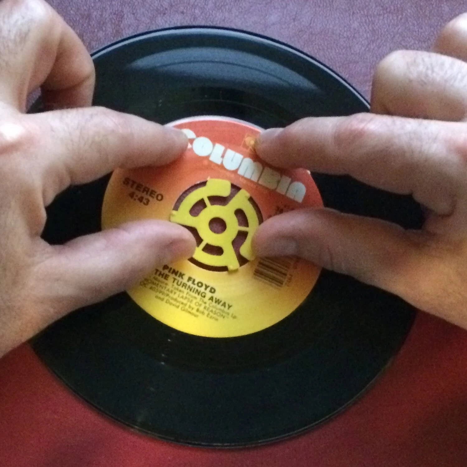 Adaptador de plástico amarillo para discos de 7" (Unidad)