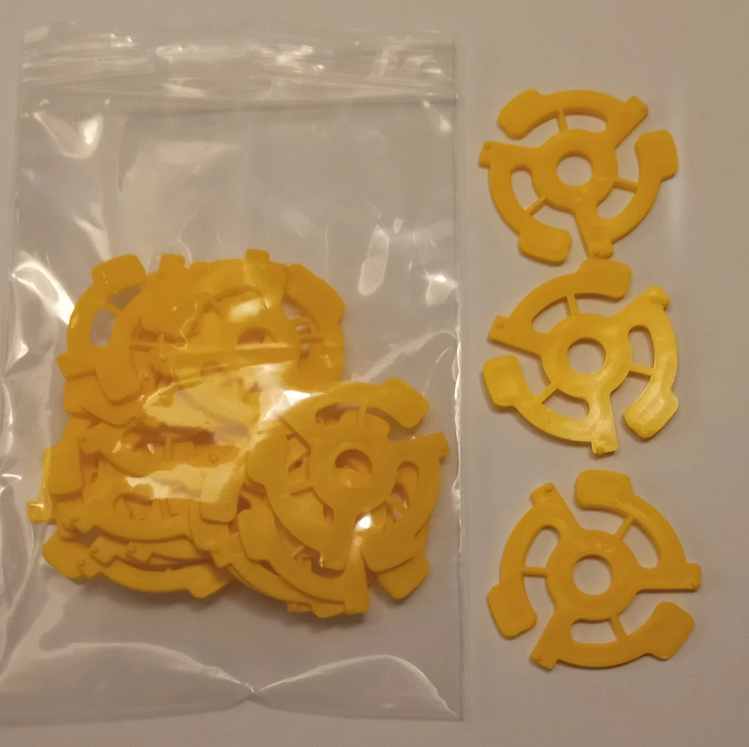 Adaptador de plástico amarillo para discos de 7" (Unidad)